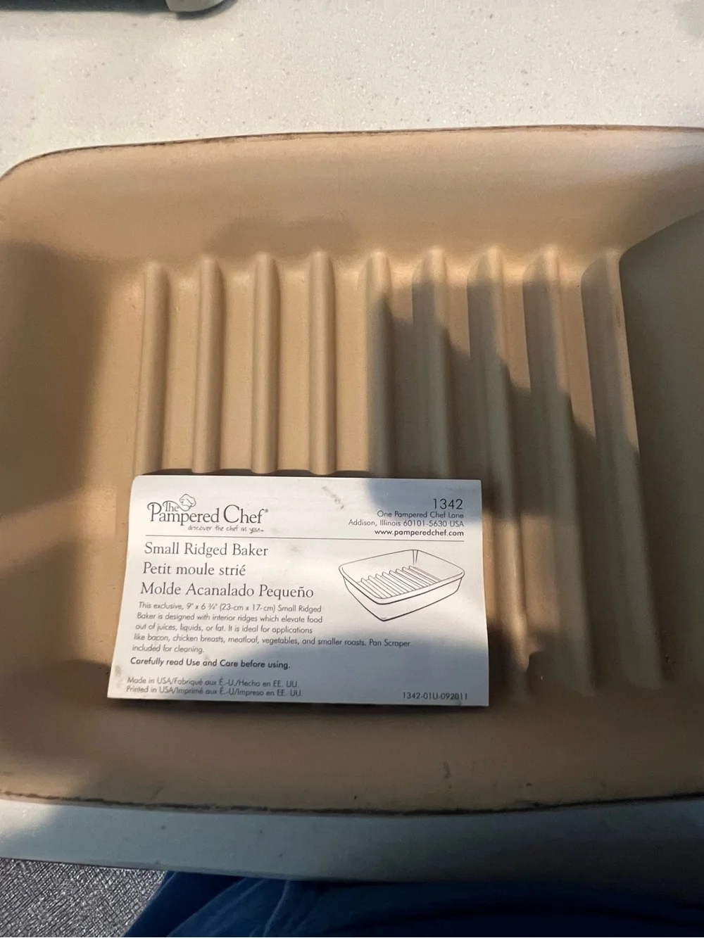 Pampered Chef Small Ridged Baker in tan-beige—never used.  New without box.